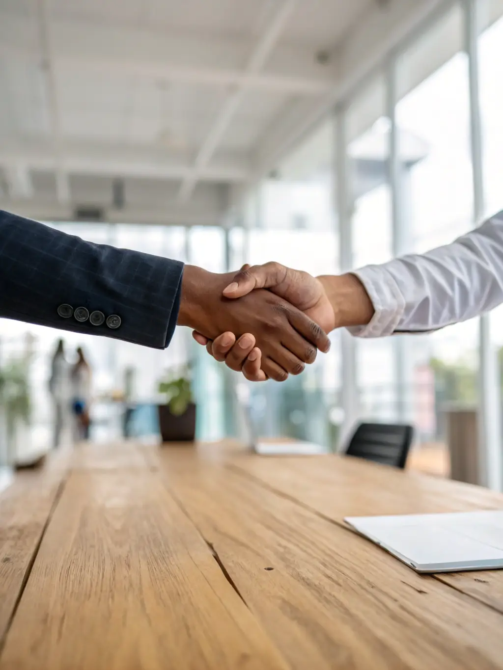 A handshake between a Hollywood Management Team representative and a client, symbolizing trust, confidentiality, and a successful partnership.